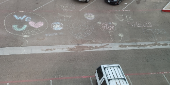 Chalk drawing on hotel parking lot